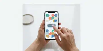 Close-up of hands holding a smartphone displaying the Shein app's coupon section, with a finger tapping to claim a discount.